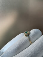 0.62 CT cushion Emerald with diamond halo ring