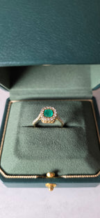 0.62 CT cushion Emerald with diamond halo ring