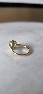 0.62 CT cushion Emerald with diamond halo ring