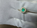 0.62 CT cushion Emerald with diamond halo ring
