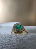 0.62 CT cushion Emerald with diamond halo ring