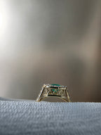 0.62 CT cushion Emerald with diamond halo ring