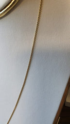 chino link chain in 18K solid gold, sclose up shot, on white necklace display | Gado Jewellers, Mississauga Ontario Fine Jewelry