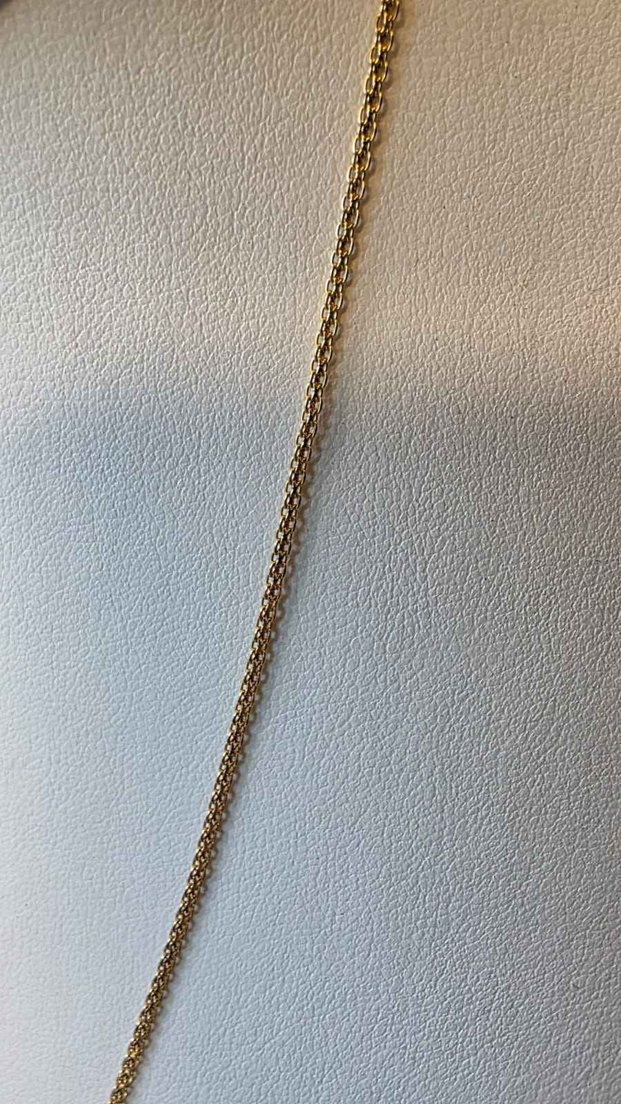 chino link chain in 18K solid gold, sclose up shot, on white necklace display | Gado Jewellers, Mississauga Ontario Fine Jewelry