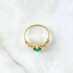 Round emerald engagement ring foundation with crown-style head and tapered diamond shoulders.