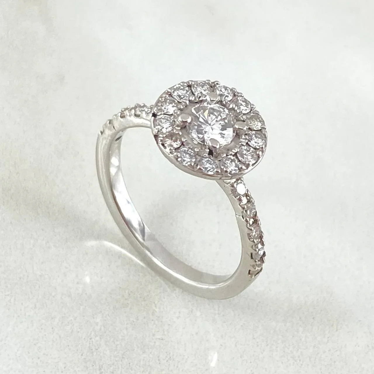 White Gold ring with a diamond on a white background