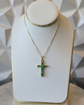 natural Colombian emerald cross pendant in 18K gold on box chain, displayed on bust | Gado Jewellers, fine Canadian jewellery 