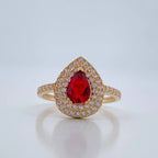 Pear-shaped halo engagement ring foundation with a ruby centrestone and double diamond halo and pavé-set shoulders