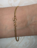 Close-up of Cuban curb link bracelet clasp and link detail in 18K gold | Gado Jewellers Fine Jewellery Mississauga