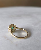 cushion cut natural colombian emerald center stone, natural diamond halo, engagement ring in 18K yellow gold, studio shot in signature Gado packaging, fully certified gemstones and gold purity | Gado Jewellers Canadian Fine Jewelry Jewellery Custom Engagement Rings