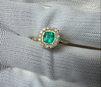 cushion cut natural colombian emerald center stone, natural diamond halo, engagement ring in 18K yellow gold, studio shot in signature Gado packaging, fully certified gemstones and gold purity | Gado Jewellers Canadian Fine Jewelry Jewellery Custom Engagement Rings
