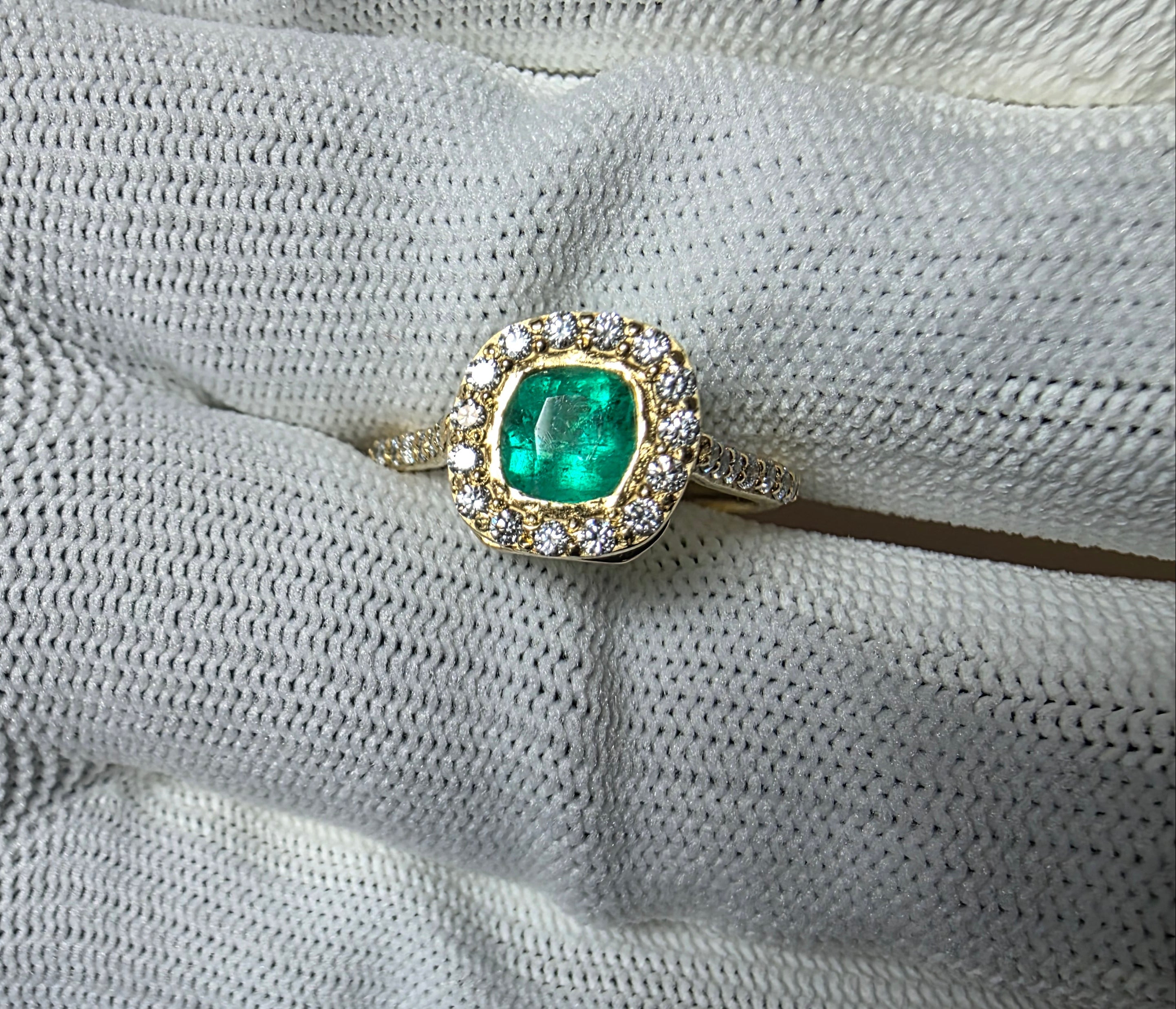 cushion cut natural colombian emerald center stone, natural diamond halo, engagement ring in 18K yellow gold, studio shot in signature Gado packaging, fully certified gemstones and gold purity | Gado Jewellers Canadian Fine Jewelry Jewellery Custom Engagement Rings