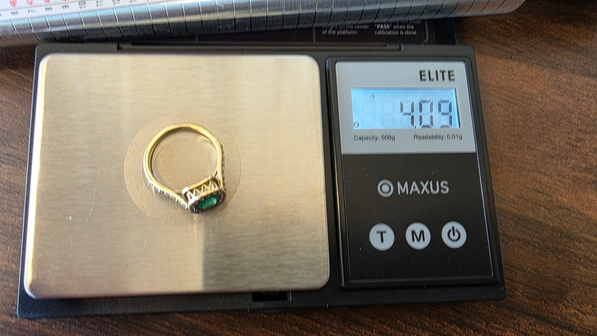Cushion Cut Emerald Ring — Diamond Halo