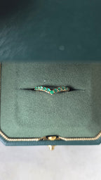 Close-up of emerald stone and setting on chevron ring in 18K gold | Gado Jewellers Fine Jewellery 