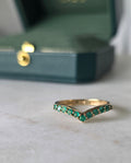Close-up of emerald stone and setting on chevron style ring in 18K gold | Gado Jewellers Fine Jewellery 