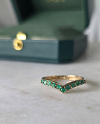 Close-up of emerald stone and setting on chevron style ring in 18K gold | Gado Jewellers Fine Jewellery 