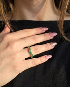 emerald chevron ring in 18K gold worn on hand | Gado Jewellers Fine Jewellery 