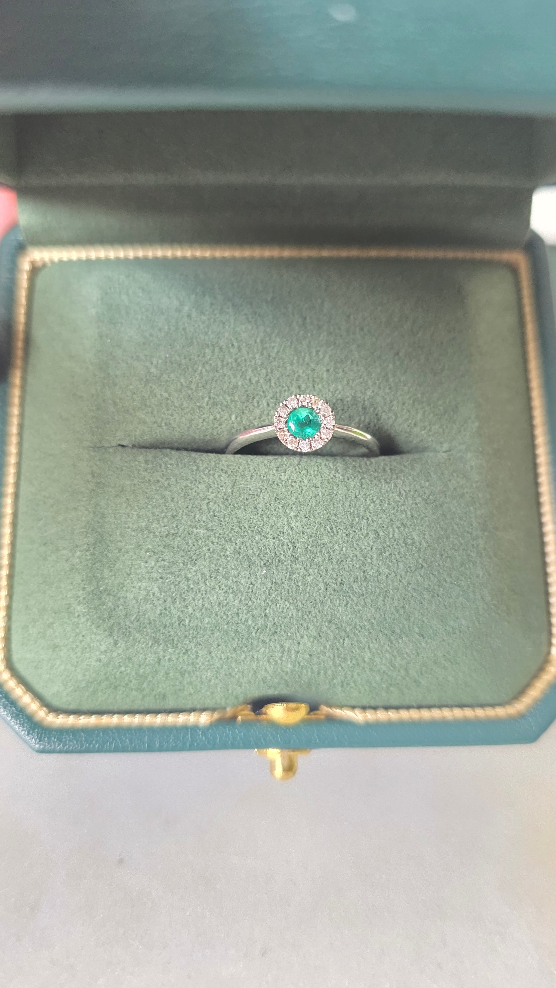 Colombian emerald halo ring in Gado green jewelry box, 18K white gold