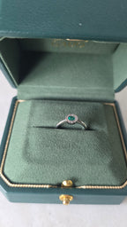 Colombian emerald halo ring in Gado green jewelry box, 18K white gold