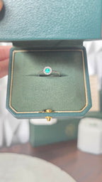 Colombian emerald halo ring in Gado green jewelry box, 18K white gold