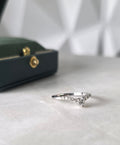 Diamond chevron ring with pavé band in 18K white gold by Gado Jewellers