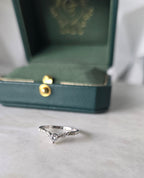 Diamond chevron ring with pavé band in 18K white gold by Gado Jewellers