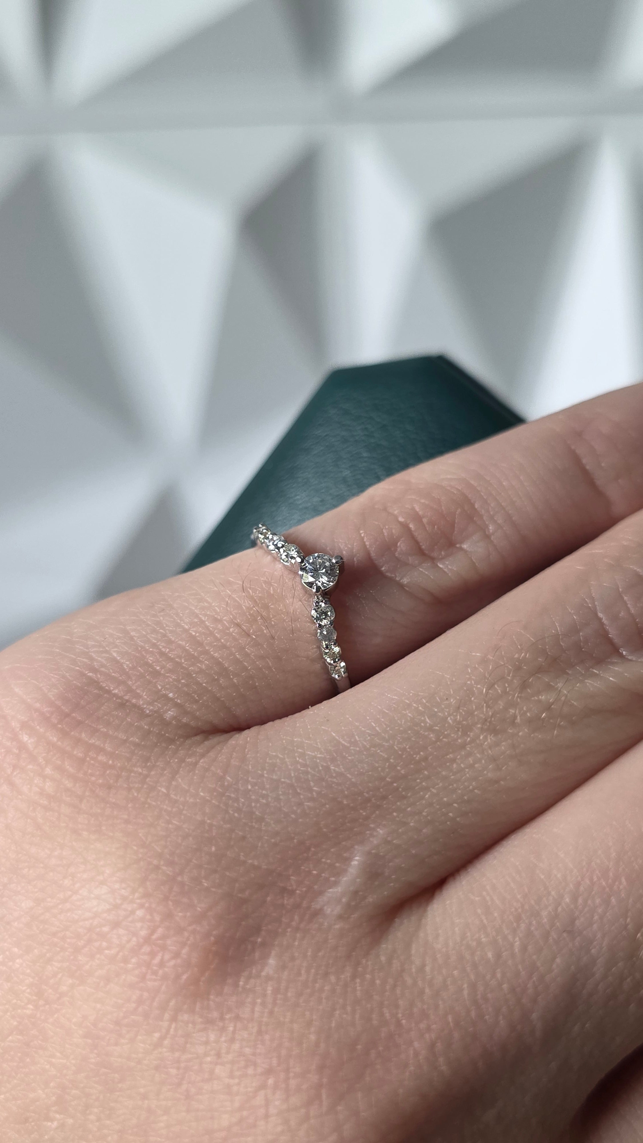 Natural diamond chevron ring worn on hand, 18K Italian white gold, Gado Jewellers