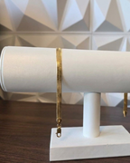 herringbone bracelet in 18K gold, studio shot | Gado Jewellers Canadian Fine Jewelry Toronto