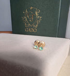 natural Colombian emerald stud earrings in 18K gold, studio shot | Gado Jewellers Fine Jewelry Canada Custom Designs