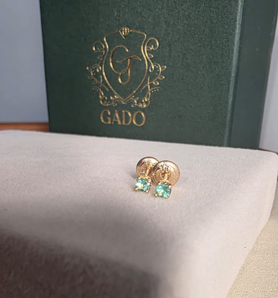 natural Colombian emerald stud earrings in 18K gold, studio shot | Gado Jewellers Fine Jewelry Canada Custom Designs