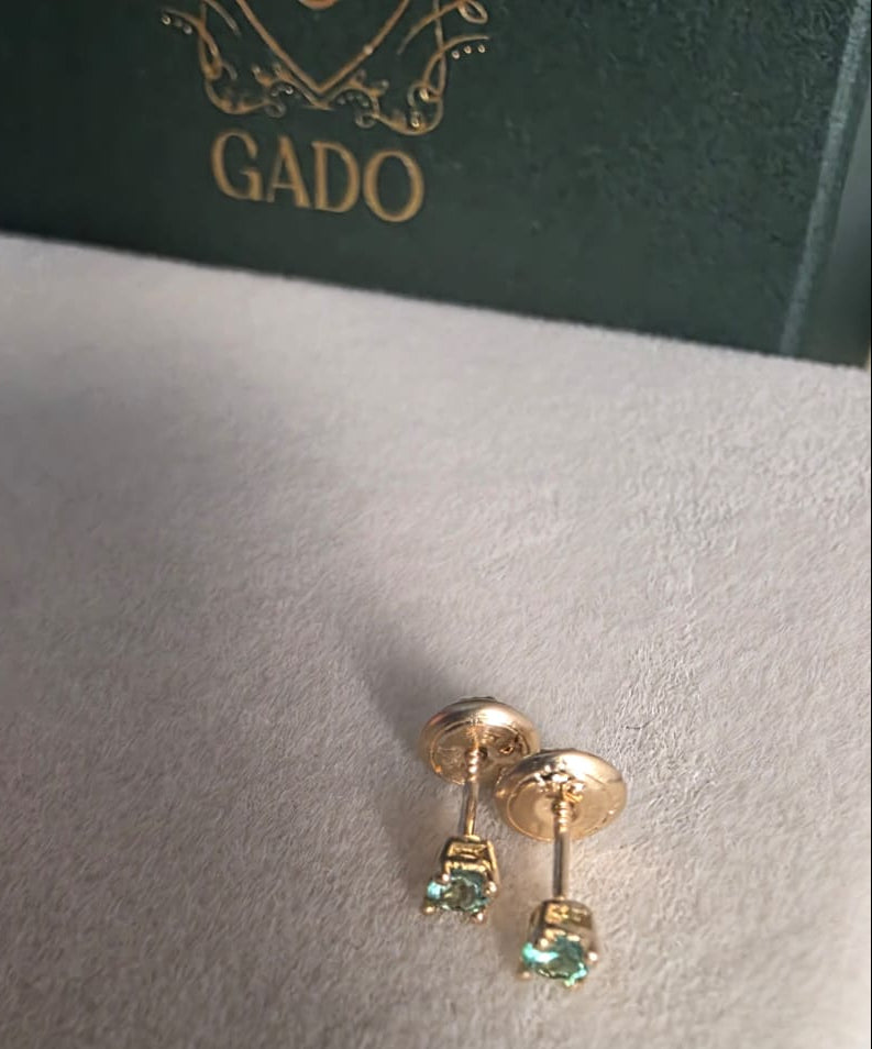 natural Colombian emerald stud earrings in 18K gold, studio shot | Gado Jewellers Fine Jewelry Canada Custom Designs