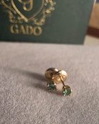 natural Colombian emerald stud earrings in 18K gold, studio shot | Gado Jewellers Fine Jewelry Canada Custom Designs