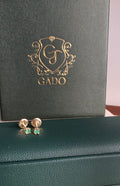 natural Colombian emerald stud earrings in 18K gold, studio shot | Gado Jewellers Fine Jewelry Canada Custom Designs