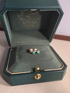 natural Colombian emerald stud earrings in 18K gold, studio shot | Gado Jewellers Canadas Haus of Emeralds Fine Jewelry