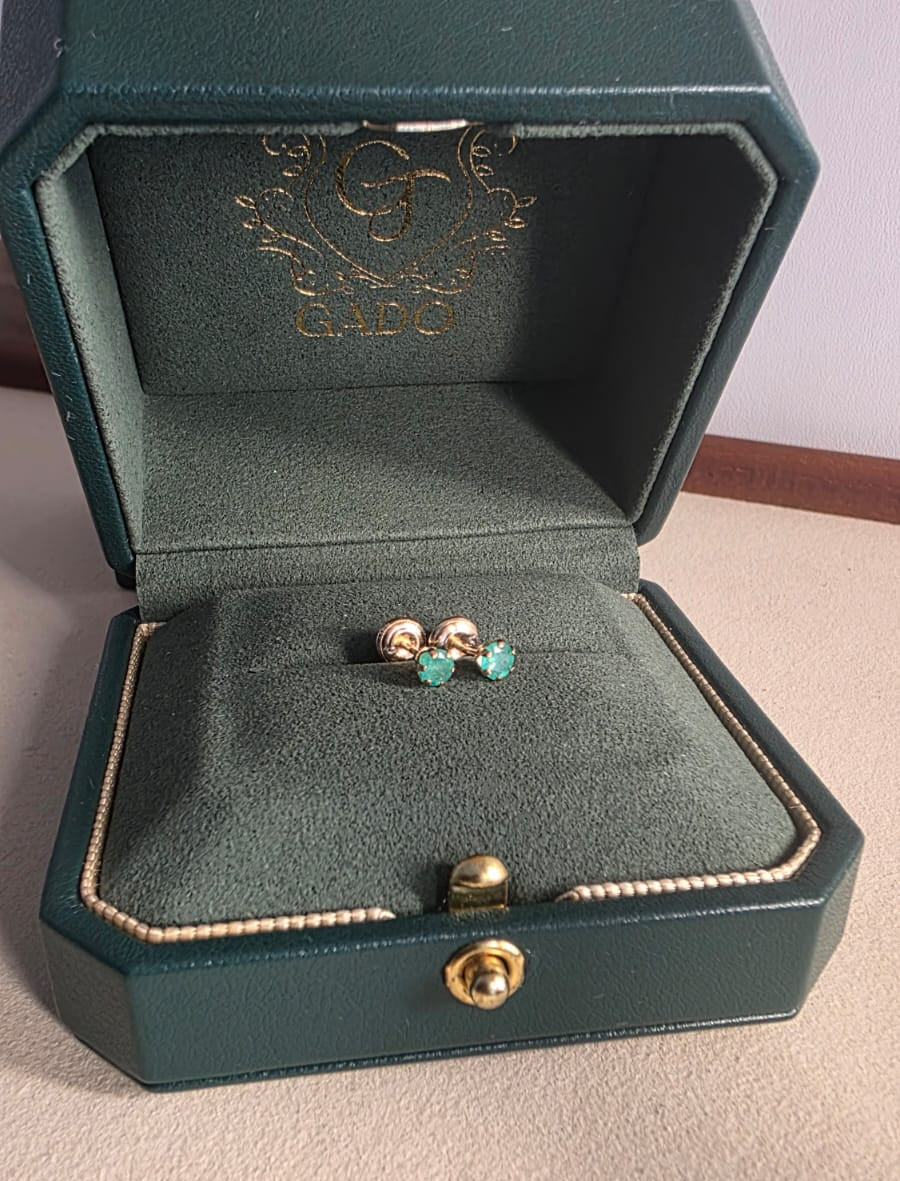 natural Colombian emerald stud earrings in 18K gold, studio shot | Gado Jewellers Canadas Haus of Emeralds Fine Jewelry