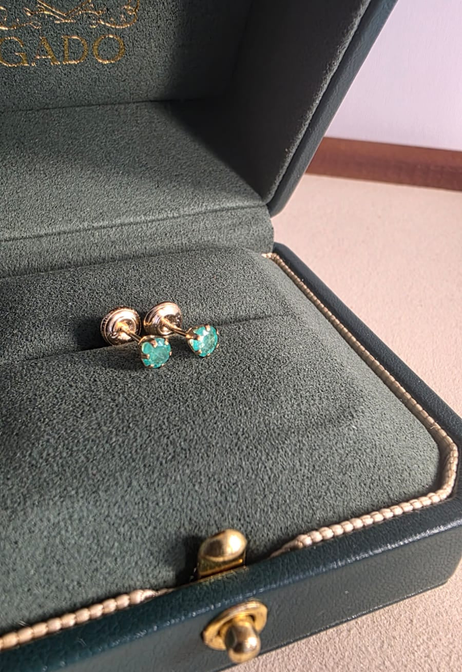 natural Colombian emerald stud earrings in 18K gold, studio shot | Gado Jewellers Canadas Haus of Emeralds Fine Jewelry