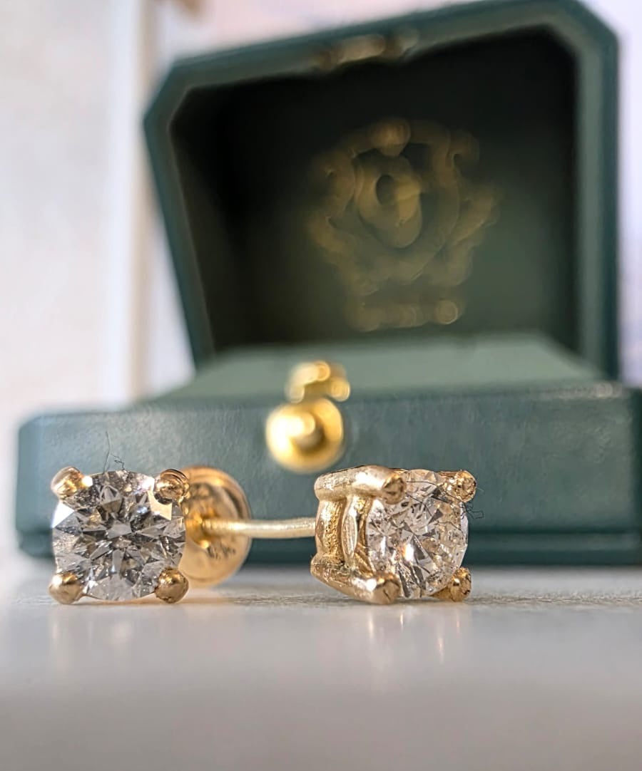 natural diamond stud earrings in 18K gold styled flat lay | Gado Jewellers Canadian Fine Jewellery