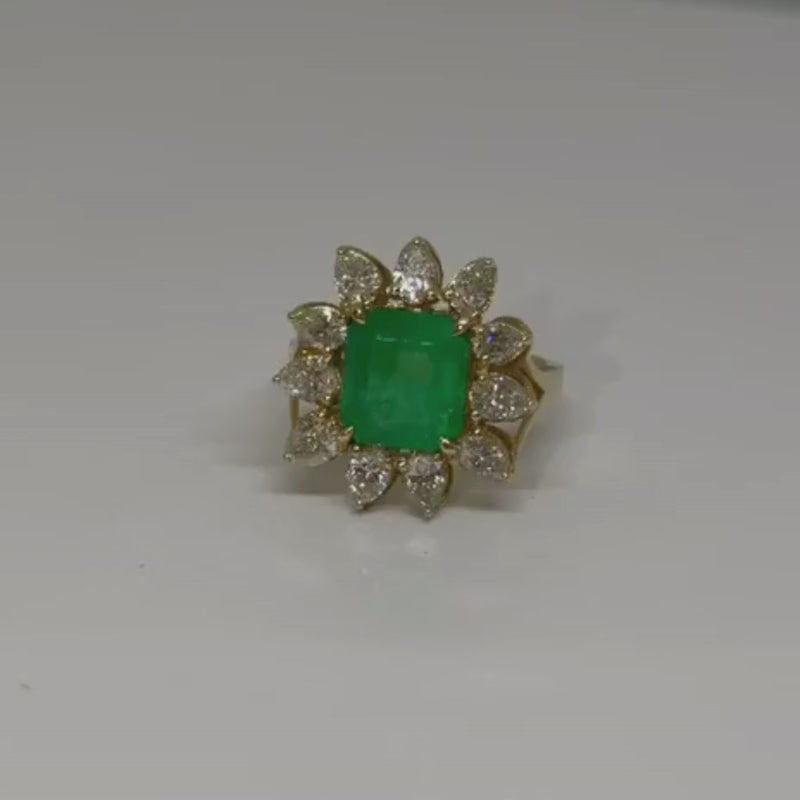 2.9CT emerald with pear diamond halo